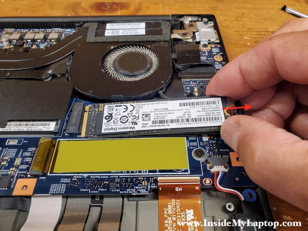 Lift up the right side of the SSD and pull it out of the slot.