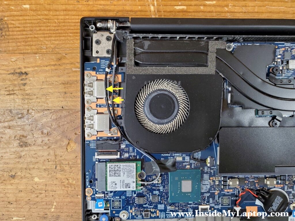 Separate the wireless antenna cables and the webcam cable from the fan.