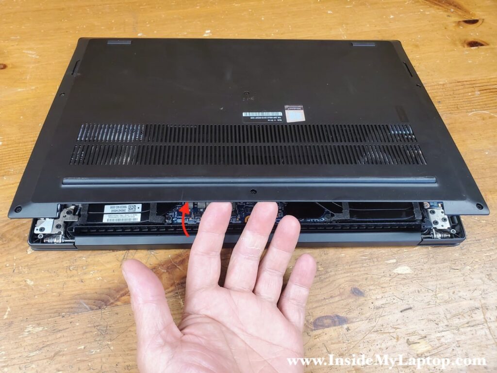Remove the bottom cover starting from the back side of the laptop.