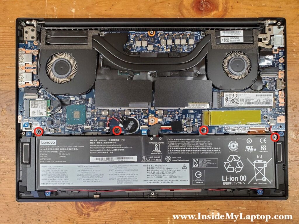 Remove four screws securing the battery.
