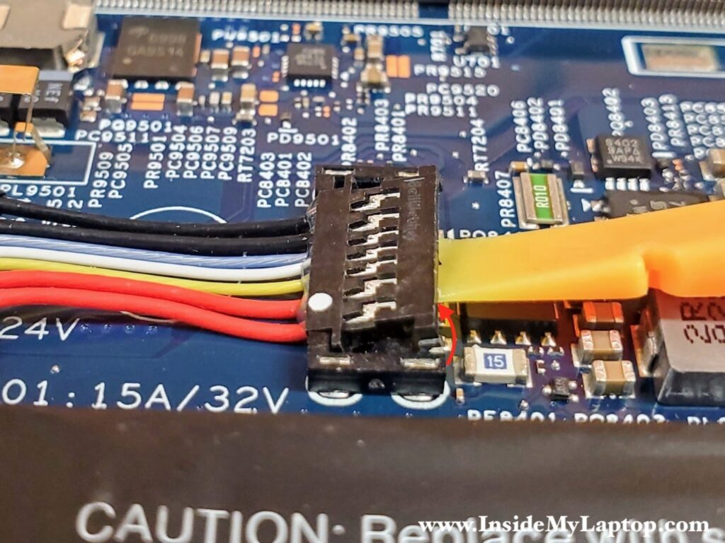Carefully lift up the right side of the connector.